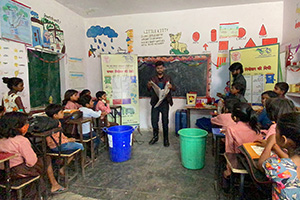 Magic show at Daraganj primary school educating children about waste segregation