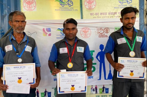 Sanitation workers receiving certificates and medals